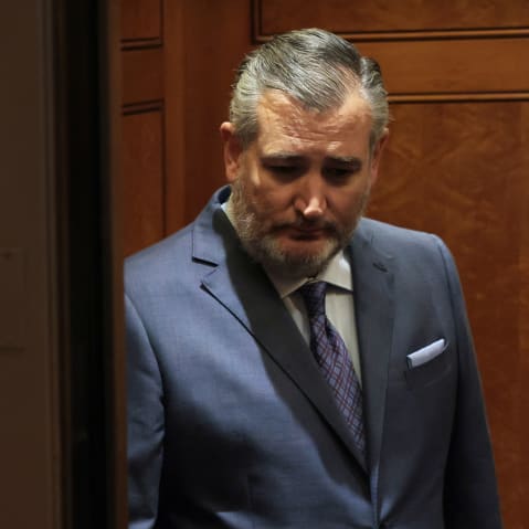 Texas Sen. Ted Cruz looks down as he stands in an elevator in the U.S. capitol.