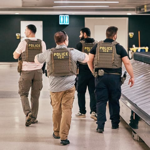 ICE agents patrol inside Newark Liberty International Airport.