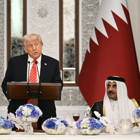 President Donald Trump and Qatar's Emir Sheikh Tamim bin Hamad al-Thani at a state dinner at the Lusail Palace in Doha, Qatar.
