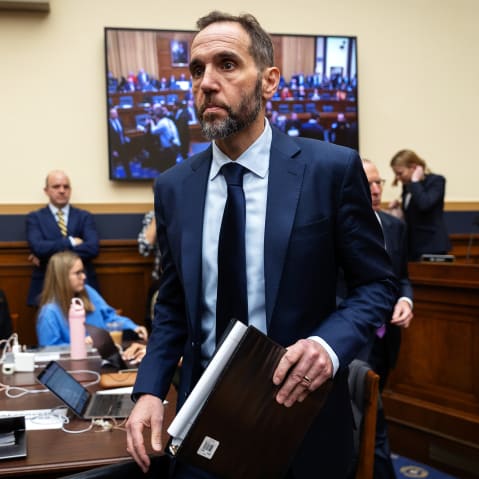 Jack Smith walks toward the desk after a break during his testimony.