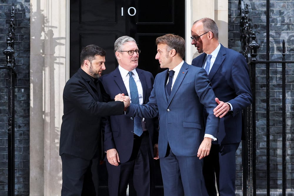 British Prime Minister Keir Starmer (second from left) says goodbye to Ukrainian President Volodymyr Zelenskyy (left), French President Emmanuel Macron (second from right) and German Chancellor Friedrich Merz after a meeting on Dec. 8, 2025, in London.