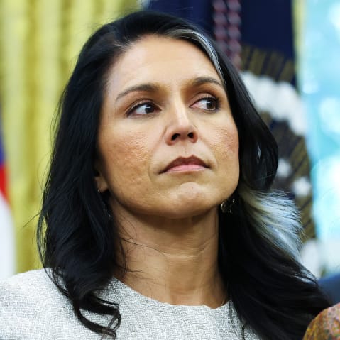 Tulsi Gabbard stands among other people looking to the side during a Diwali celebration at the White House.