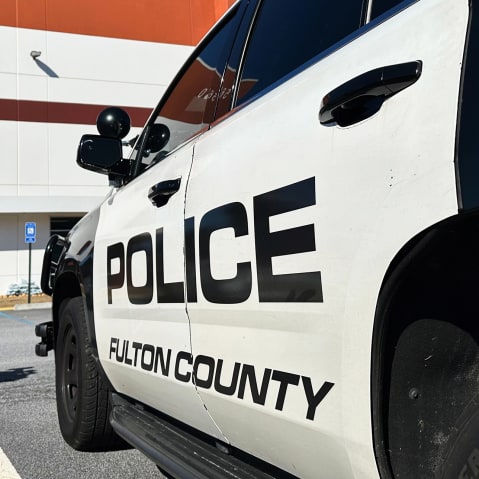 Police vehicles are seen outside the Fulton County elections hub on Jan. 28, 2026, in Union City, Ga.