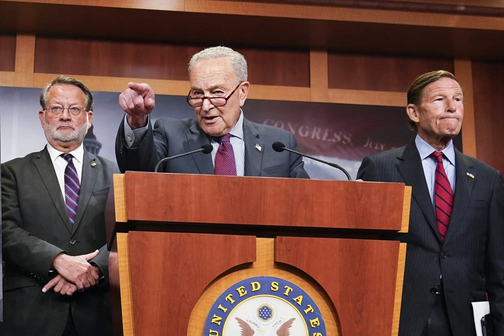 US Senate Minority Leader Chuck Schumer (C), alongside Senator Gary Peters (L), and Senator Richard Blumenthal (R), speaking during a news conference calling on the Trump administration to release further information on the Jeffrey Epstein case on July 30, 2025 at the US Capitol.