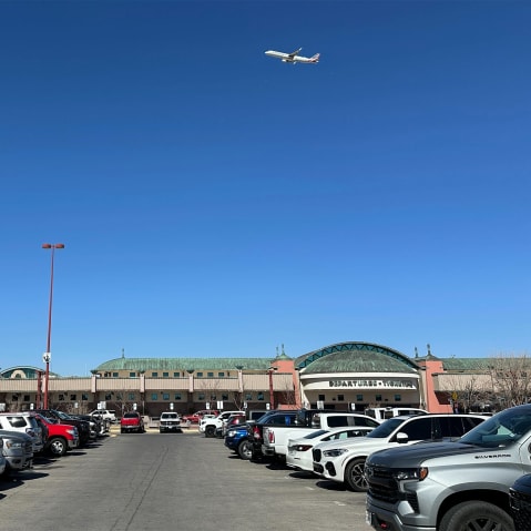 A plane flies over El Paso International Airport.