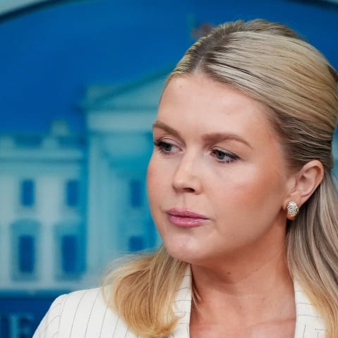 Leavitt is seen on the right side of a closeup frame.