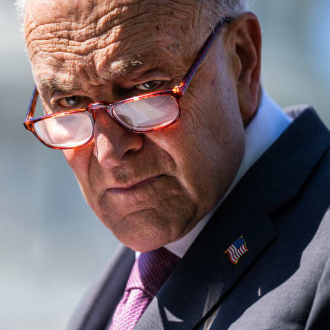 Senate Minority Leader Chuck Schumer attends a news conference outside the Capitol.