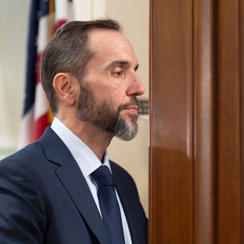 Former Department of Justice Special Counsel Jack Smith enters a room.