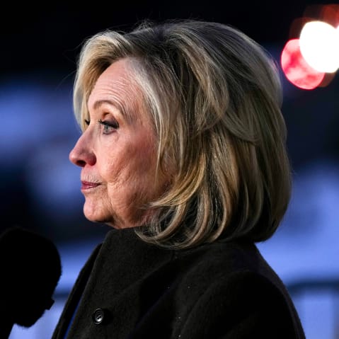 Hillary Clinton is seen from the side as she speaks to the press in this closeup shot.