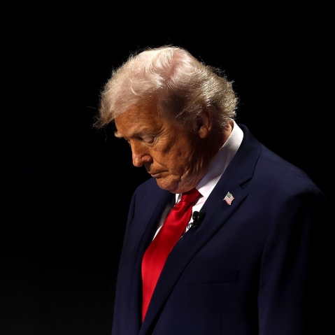 President Donald Trump on an empty-looking stage.