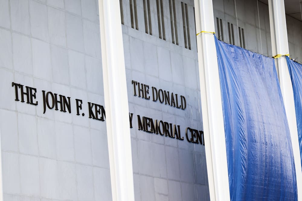 Workers adjust the name of the &ldquo;John F. Kennedy Memorial Center for the Performing Arts" on Dec. 19, 2025 in Washington, D.C.