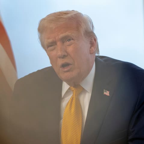 President Donald Trump speaks during a call with service members at his Mar-a-Lago club on Dec. 24, 2025, in Palm Beach, FL.