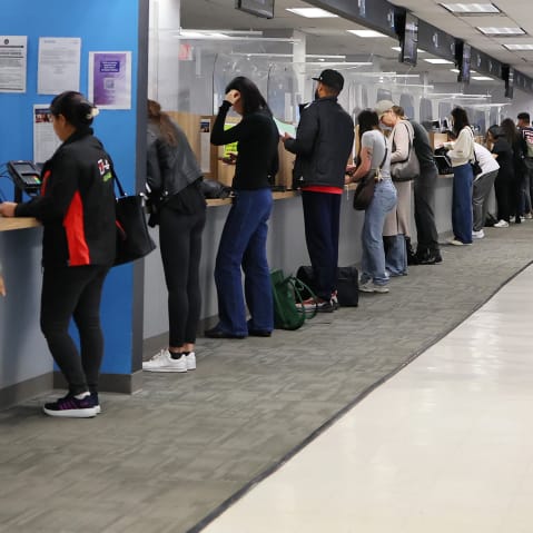 People line up at the New York State DMV in New York City.