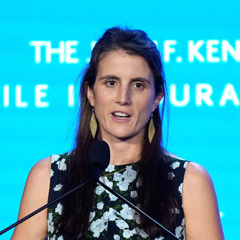 Tatiana Schlossberg speaks at a podium.