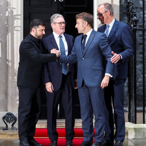 British Prime Minister Keir Starmer (second from left) says goodbye to Ukrainian President Volodymyr Zelenskyy (left), French President Emmanuel Macron (second from right) and German Chancellor Friedrich Merz after a meeting on Dec. 8, 2025, in London.