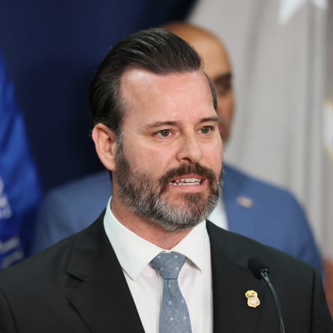 Jason A. Reding Qui&ntilde;ones speaks into a microphone.