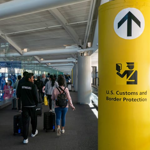 Passengers walk through the terminal toward U.S. Customs and Border Protection at New Jersey's Newark Liberty International Airport on Nov. 3, 2024.