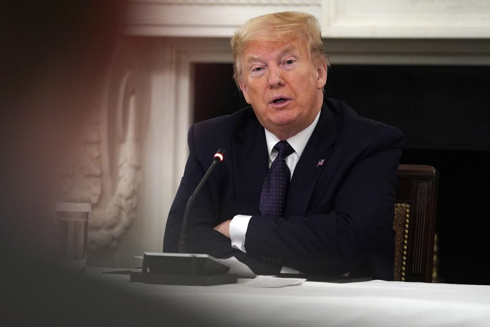 Image: President Donald Trump listens during a meeting with restaurant industry executives about the coronavirus response, in the State Dining Room of the White House