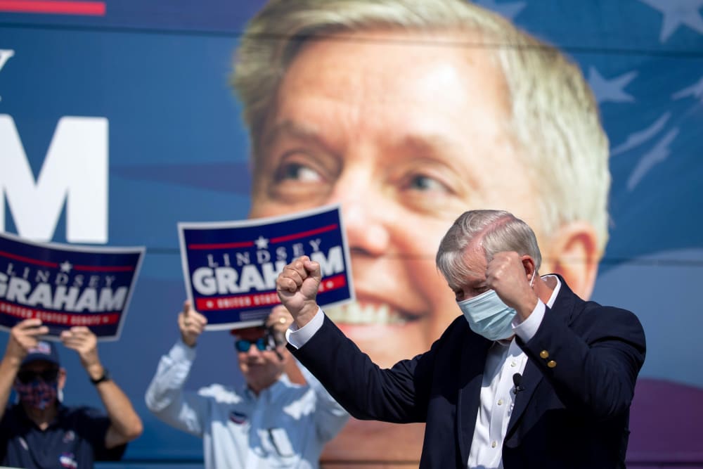 Image: Image: Sen. Lindsey Graham greets supporters in North Charleston, S.C., on Oct. 16, 2020.