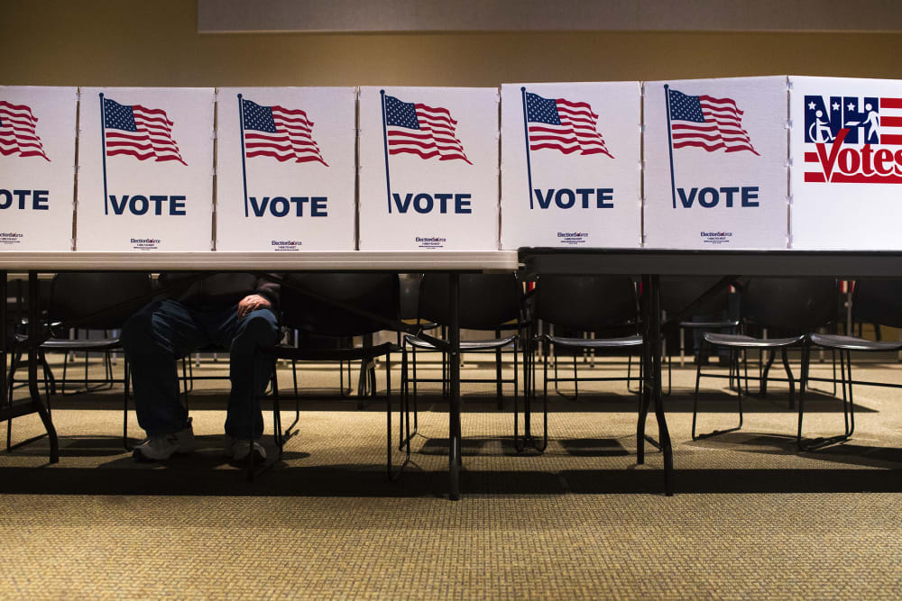 A voter casts their ballot at a polling place in Nashua, N.H., on Feb. 9, 2016. (Photo by Cassi Alexandra/For The Washington Post/Getty)