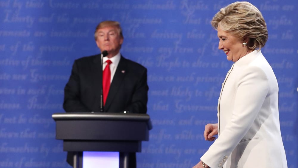 Democratic presidential nominee Hillary Clinton walks off the stage as Republican nominee Donald Trump remains at his podium after their third and final 2016 presidential campaign debate in Las Vegas, Nev., Oct. 19, 2016. (Photo by Rick Wilking/Reuters)