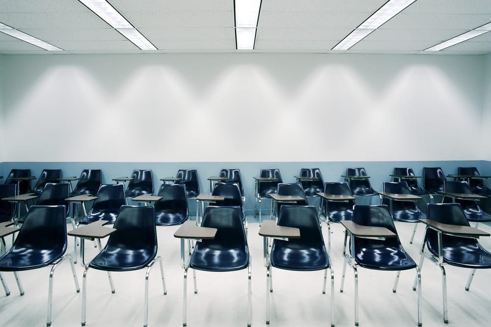Desks in a classroom. (Photo by Bob O'Connor/Gallery Stock)