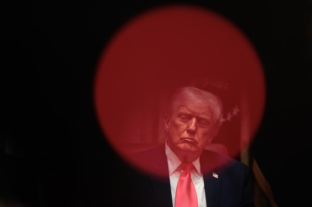 President Donald Trump sits in the Cabinet room.