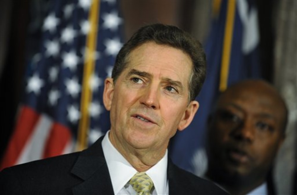 Then-Rep. Tim Scott, standing on Jim DeMint's good side. (AP Photo/Rainier Ehrhardt)