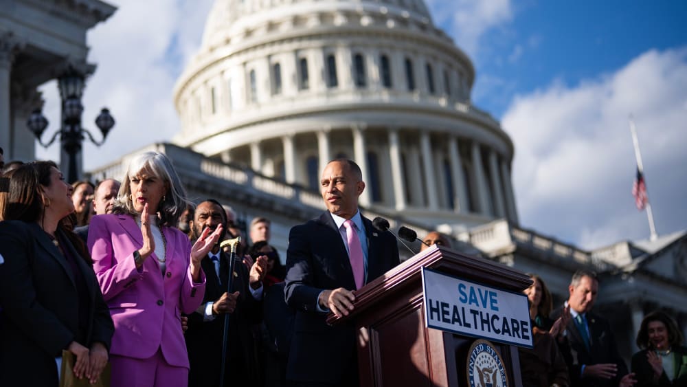 House Minority Leader Hakeem Jeffries conducts a rally at the Capitol to oppose the Senate-passed spending bill that would reopen the government because it does not extend the the Affordable Care Act tax credits.