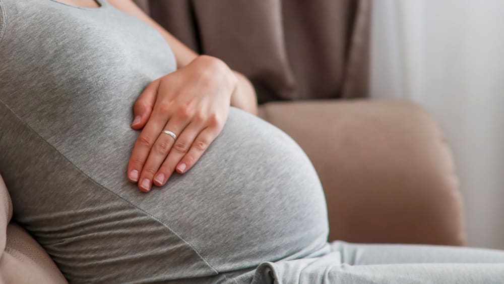 Pregnant woman on couch