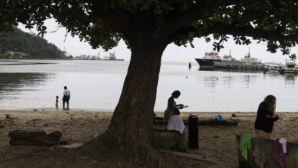 People along the Gulf of Paria in Port of Spain, Trinidad and Tobago.