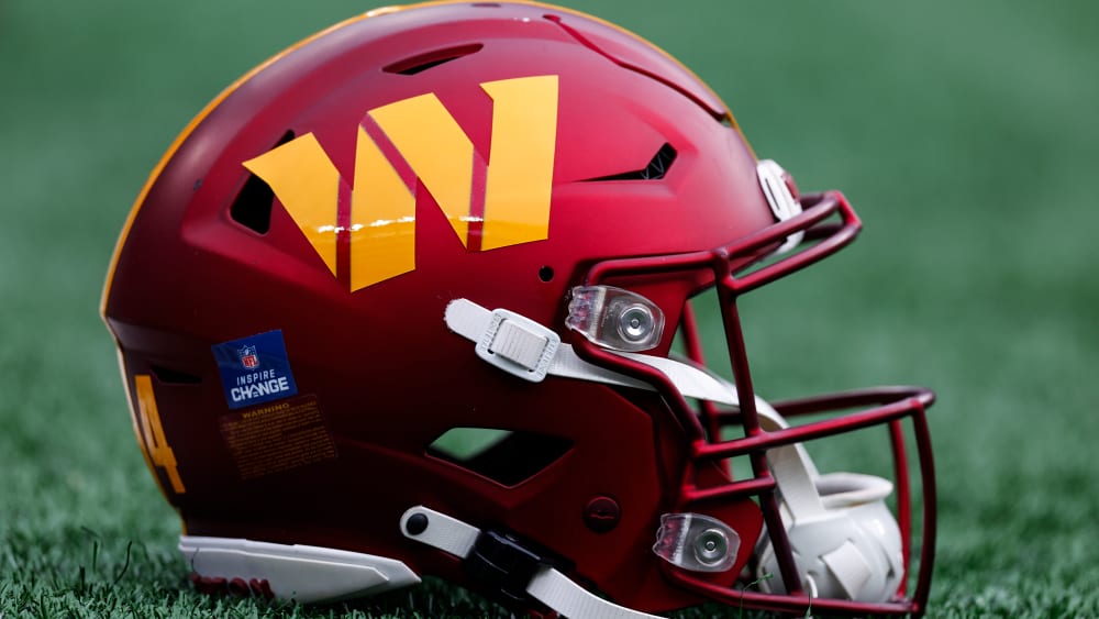 A Washington Commanders helmet on the field