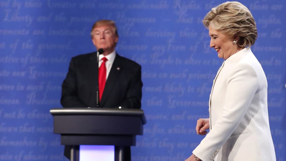 Democratic presidential nominee Hillary Clinton walks off the stage as Republican nominee Donald Trump remains at his podium after their third and final 2016 presidential campaign debate in Las Vegas, Nev., Oct. 19, 2016. (Photo by Rick Wilking/Reuters)