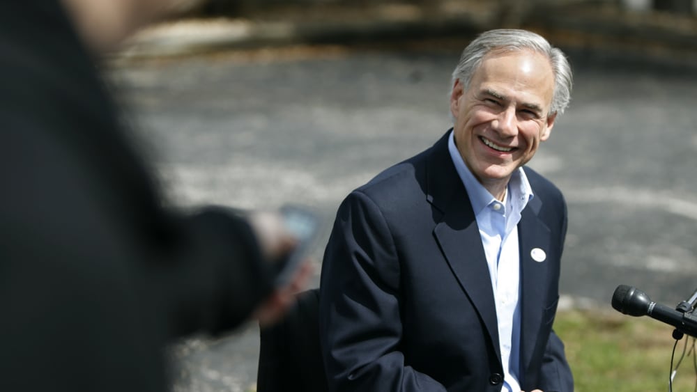 Texas Attorney General Greg Abbott speaks to the press after voting in the Texas primary in Austin, March 4, 2014.
