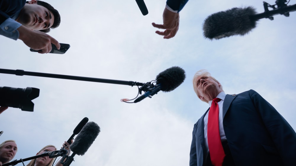 President Donald Trump talks to reporters in Joint Base Andrews, M.D.