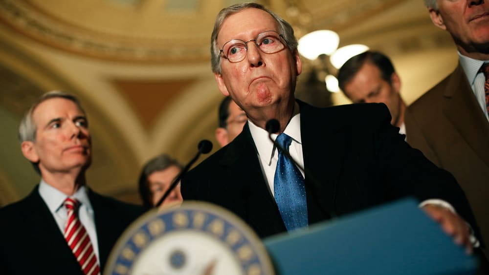 Sen. Mitch McConnell (C) (R-KY) answers questions following a weekly policy luncheon at the U.S. Capitol on March 11, 2014 in Washington, DC
