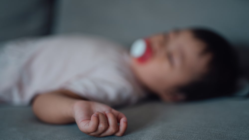 A sleeping baby, out of focus.