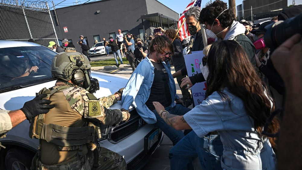 Demonstrators protesting outside the U.S Immigration & Customs Enforcement facility tussle with federal agents on Sept. 19, 2025, in Broadview, Illinois.