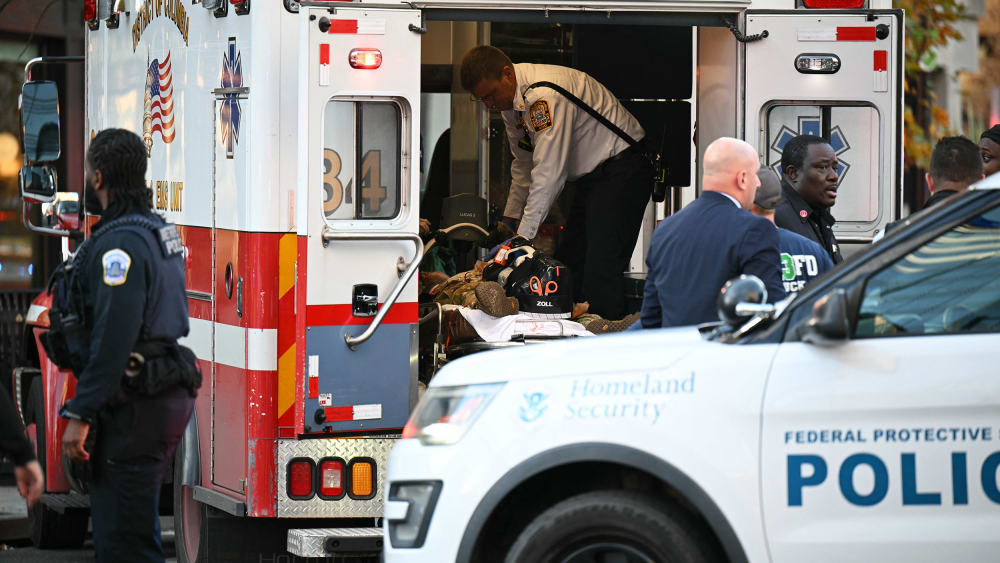An unidentified man in military fatigues lies on a stretcher inside an ambulance in downtown Washington, D.C.
