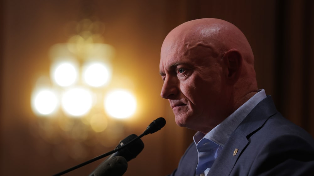 Sen. Mark Kelly speaks at a news conference in the Capitol.
