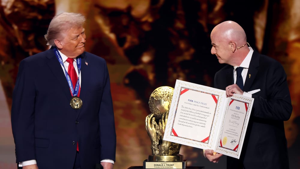 President of FIFA Gianni Infantino, right, presents President Donald Trump with the FIFA Peace Prize during the FIFA World Cup 2026 Official Draw at John F. Kennedy Center for the Performing Arts in Washington, D.C.