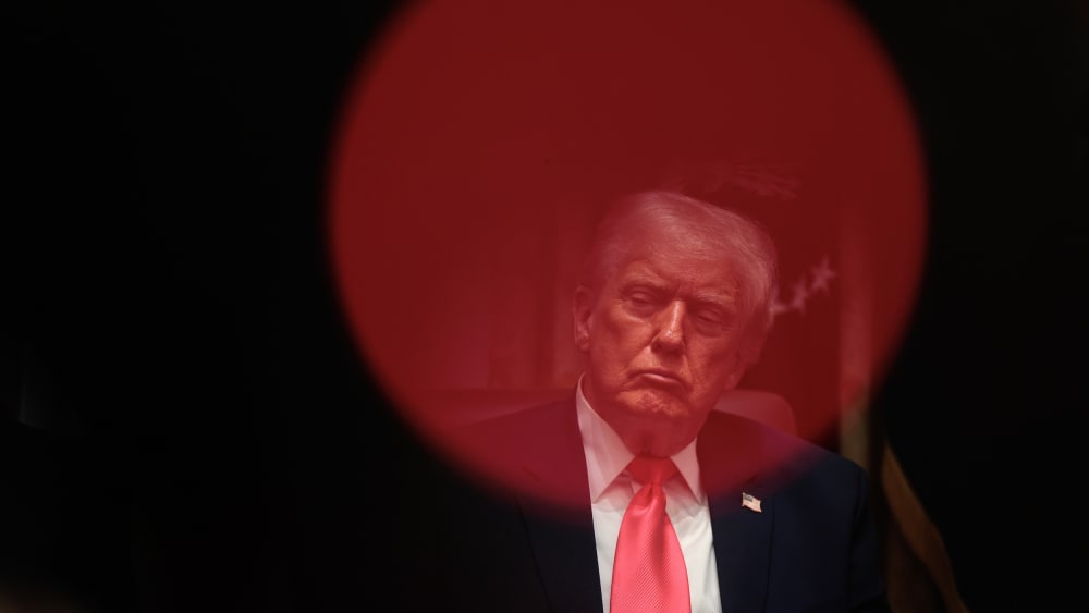 President Donald Trump sits in the Cabinet room.