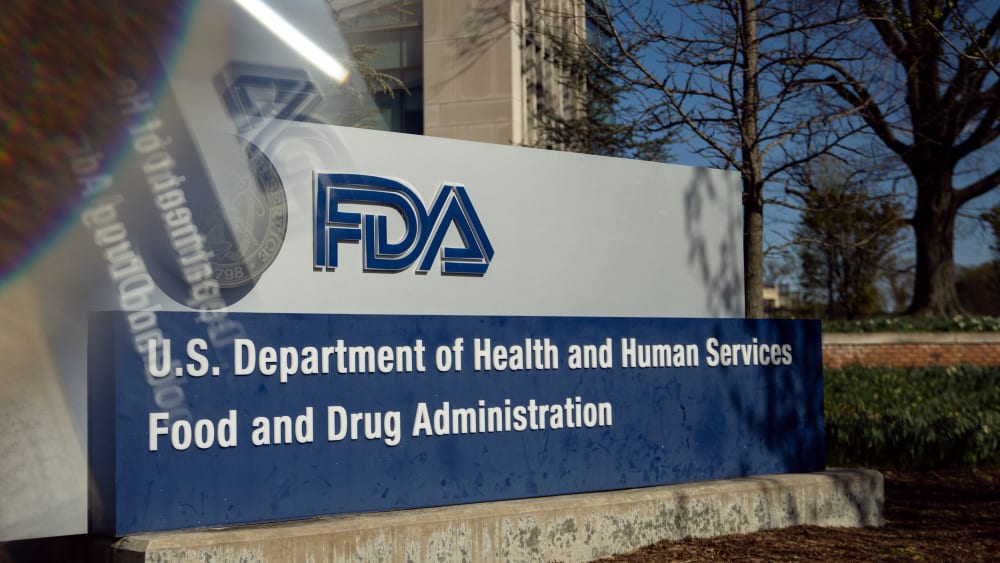 A sign for the U.S. Food and Drug Administration in Silver Spring, M.D., as seen through a prism on April 8, 2025.