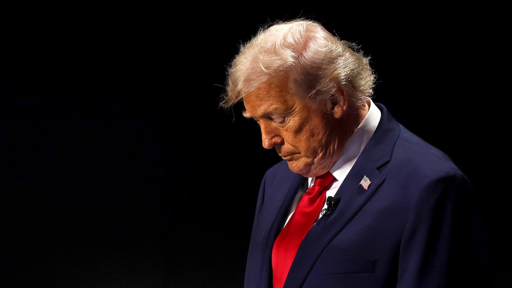 U.S. President Donald Trump with his head down.