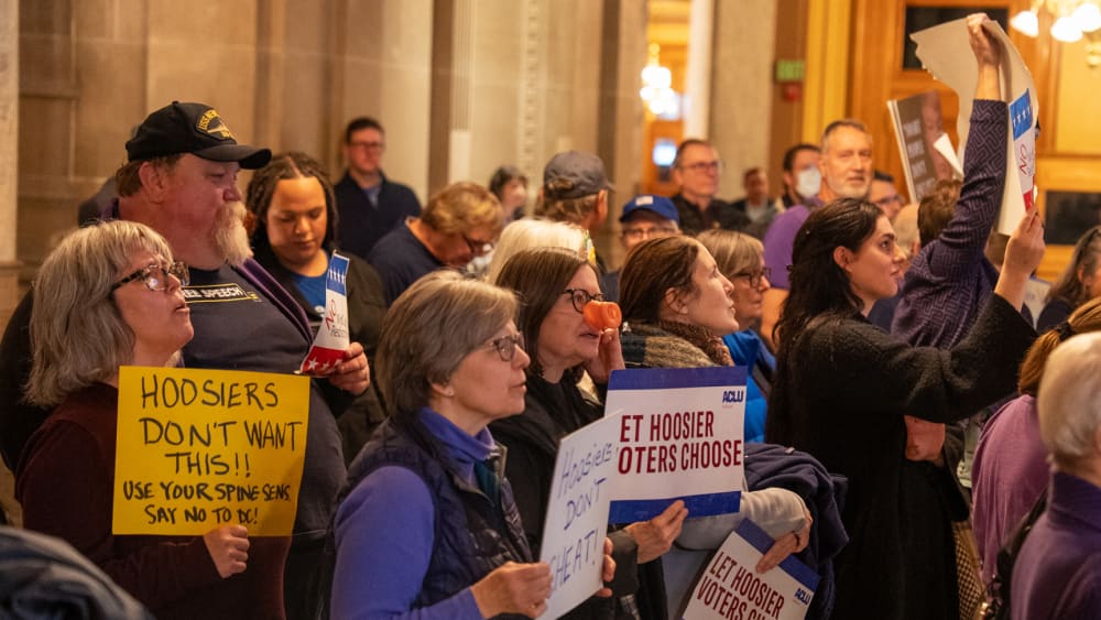 Demonstrators protest at the Indiana Statehouse in Indianapolis, I.N., on Dec. 11, 2025.