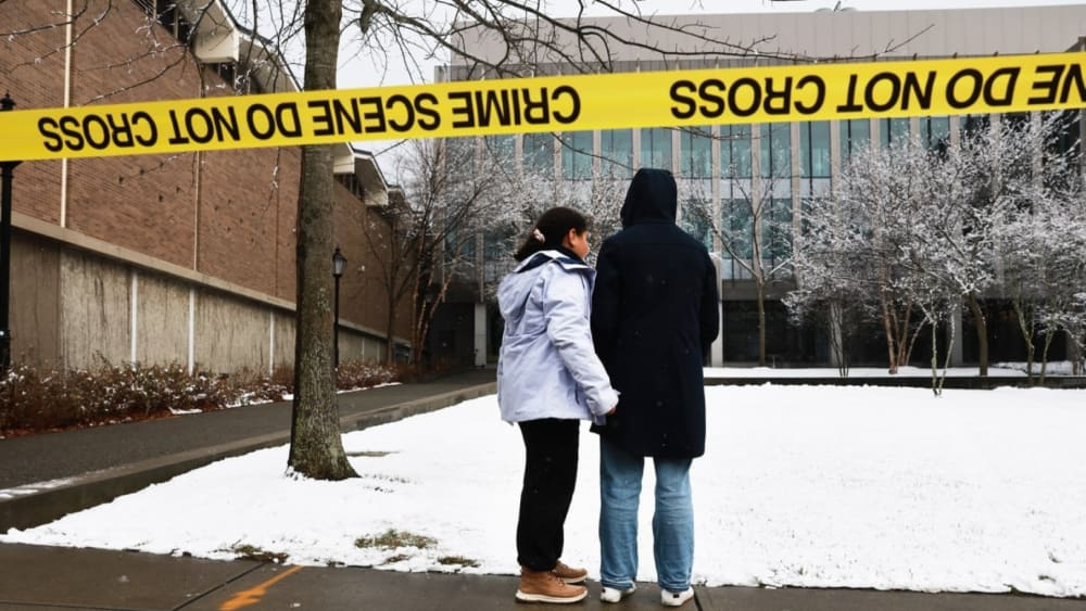 New urgency in search for Brown University shooter after person of interest released