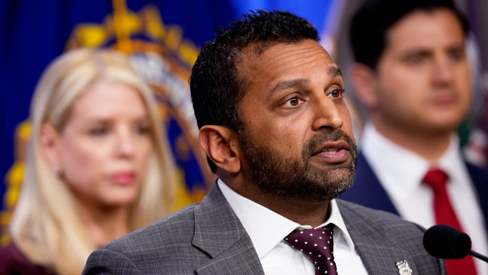 FBI Director Kash Patel and General Pam Bondi speaking at a news conference in Washington, D.C.