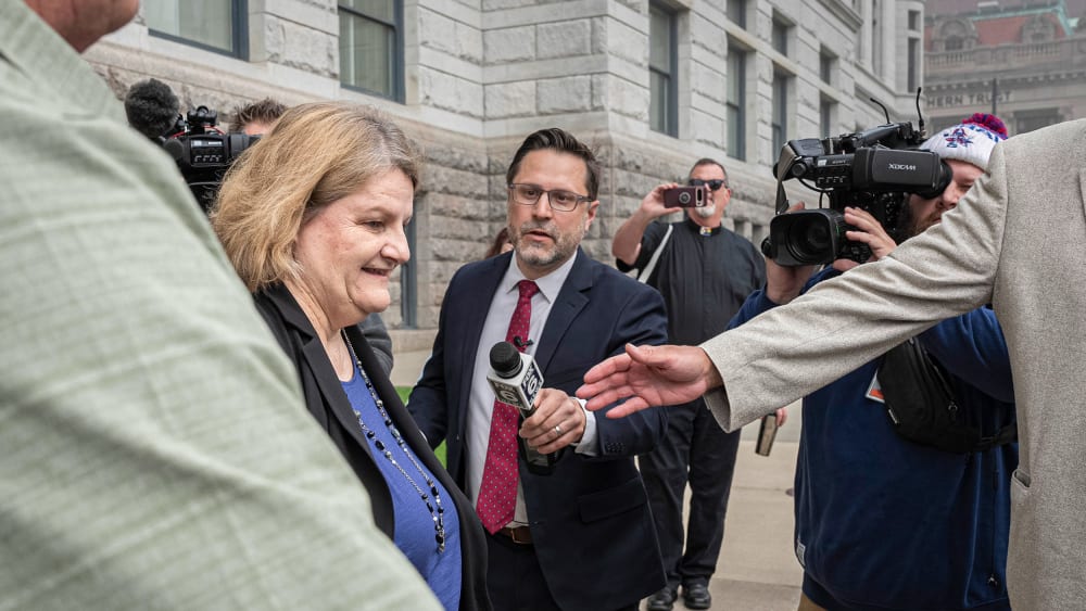 Milwaukee County Circuit Judge Hannah Dugan leaves the federal courthouse after a hearing.