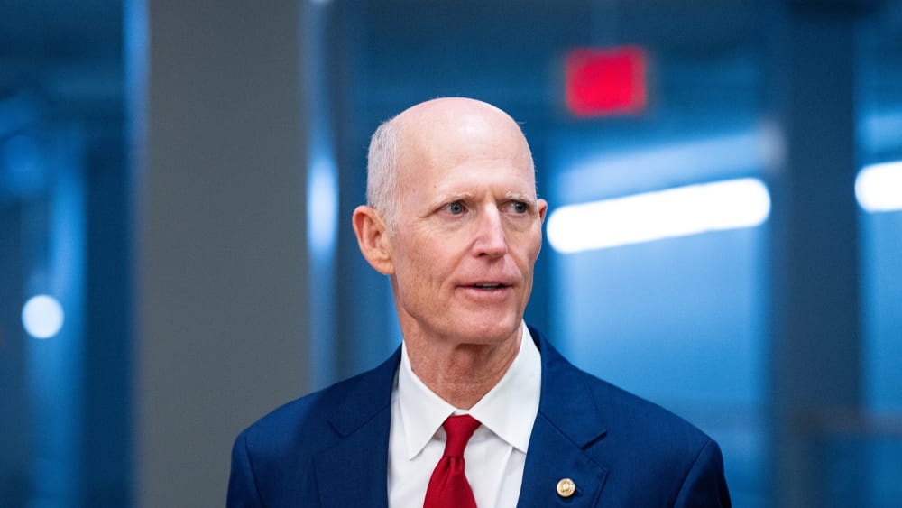 Sen. Rick Scott arrives for a vote at the Capitol.