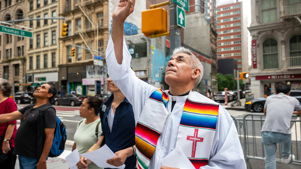 Members of the New Sanctuary Coalition (NSC) participate in a weekly prayer outside of immigration court at the Jacob K. Javits Federal Building on July 10, 2025, in New York City.